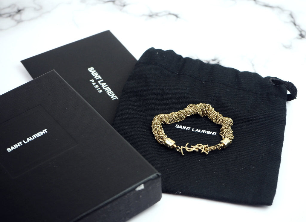 SAINT LAURENT Cassandre gold-tone crystal bracelet | Fashion bracelets  jewelry, Crystal bracelets, Gold tones